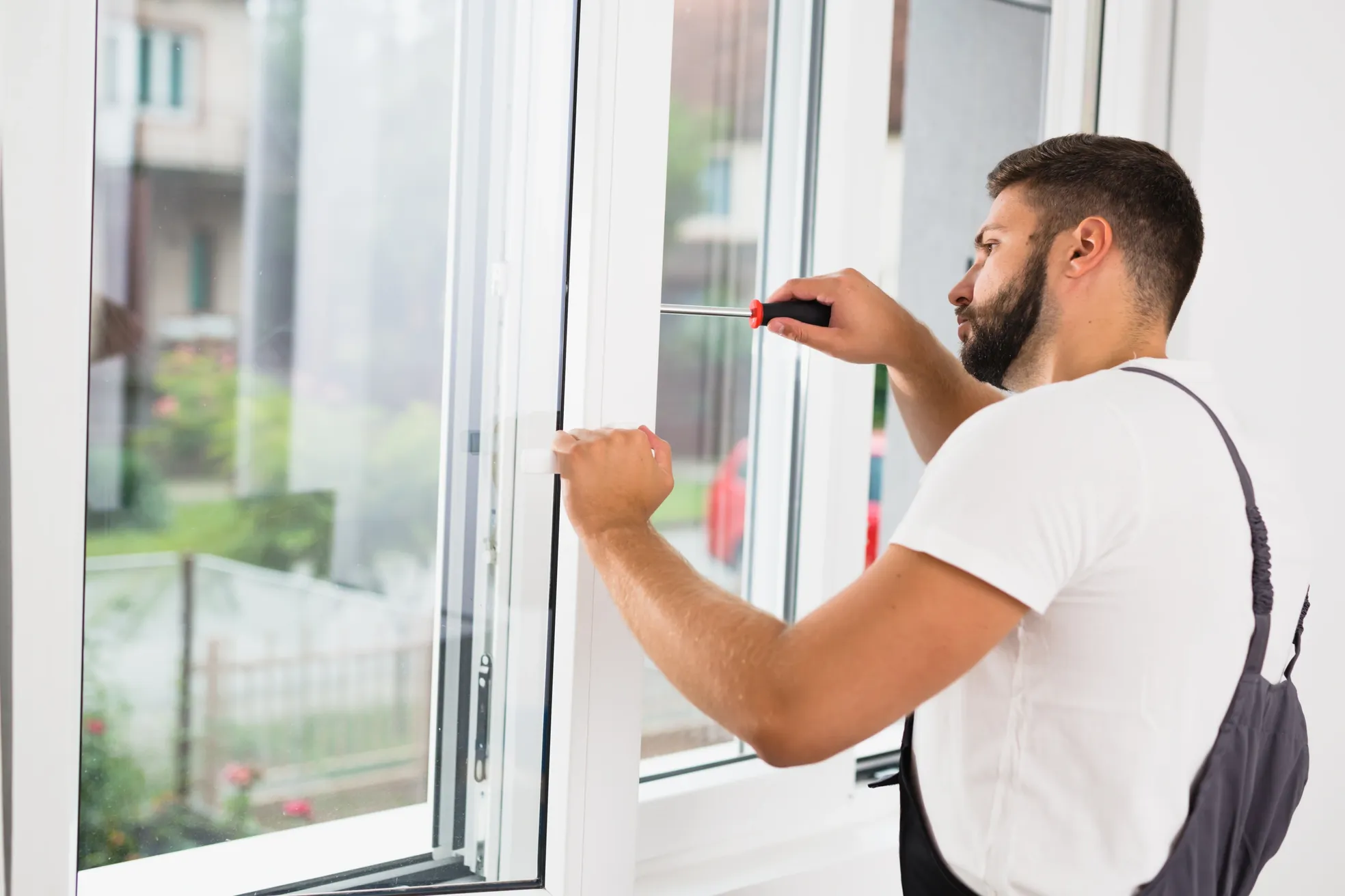 Tech installing a window
