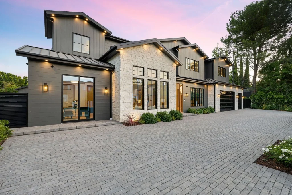 Tan house with large glass windows