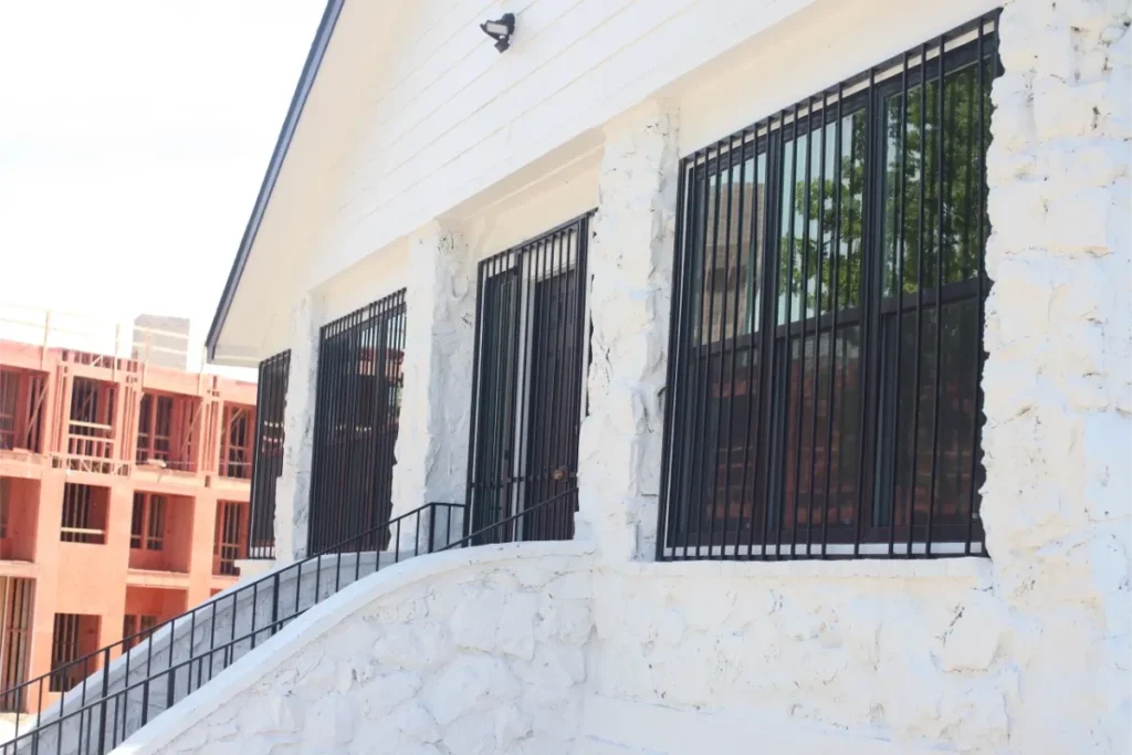 Black windows with metal bars.  Arlington Window Replacement Reviews 

